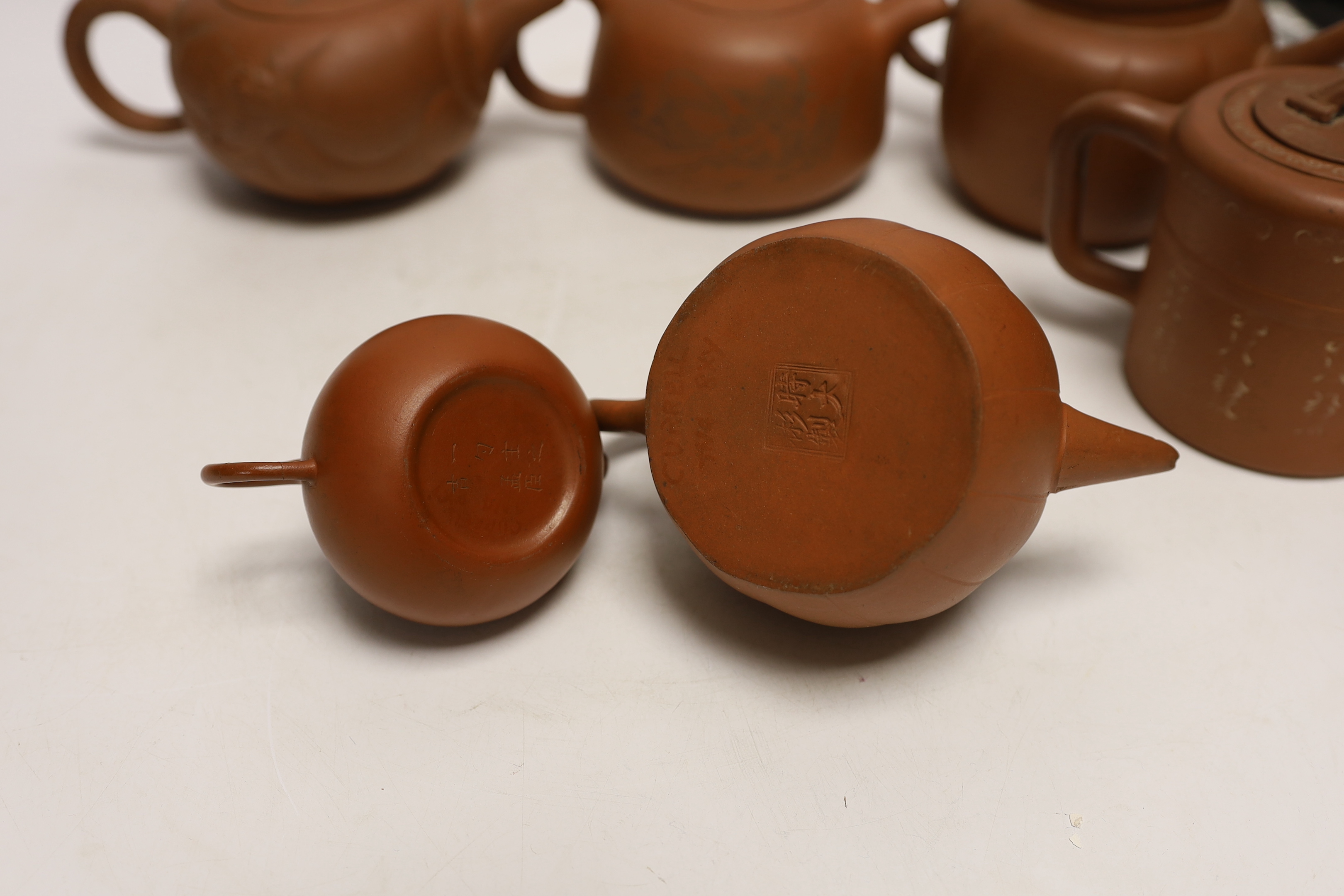 Six Chinese Yixing terracotta teapots, largest 11cm
